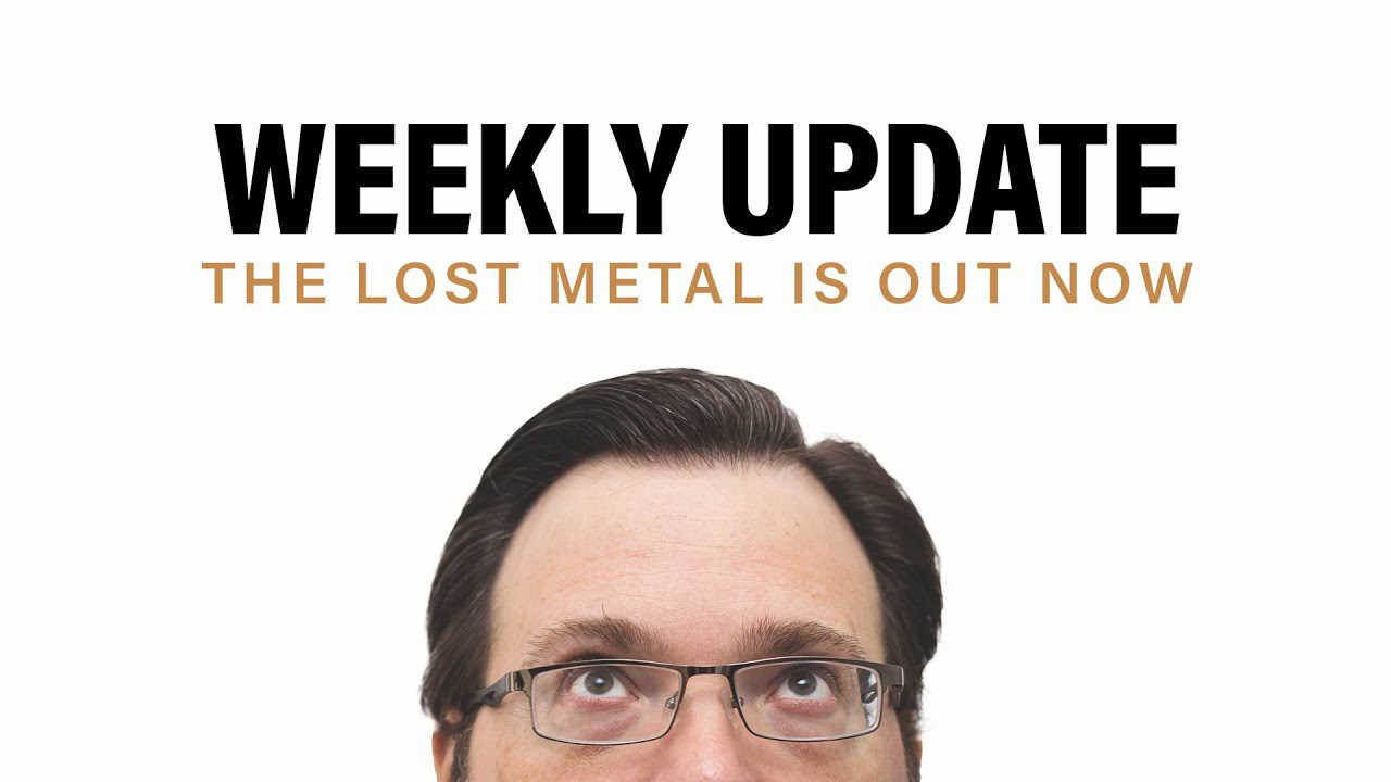 Photo of Brandon's face peaking over the screen looking up at the text, which reads: Weekly Update The Lost Metal is out now